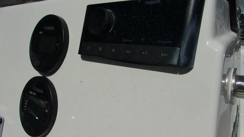 Slide: The Image of Control panel of 2025 Key West 210 Bay Reef boat with Yamaha gauges and Fusion stereo. - 22