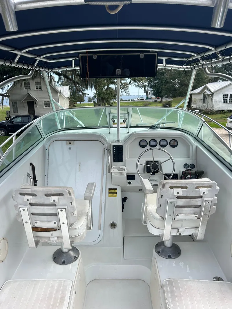 Slide: The Image of 2001 Glacier Bay Island Runner boat cockpit with dual seats and steering wheel. - 12