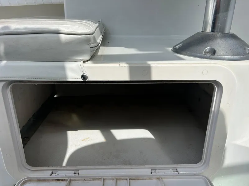 Slide: The Image of Open storage compartment on a 2001 Glacier Bay Island Runner boat. - 17