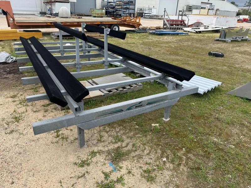 Slide: The Image of Boat trailer for 2001 Glacier Bay Island Runner on grassy lot. - 18