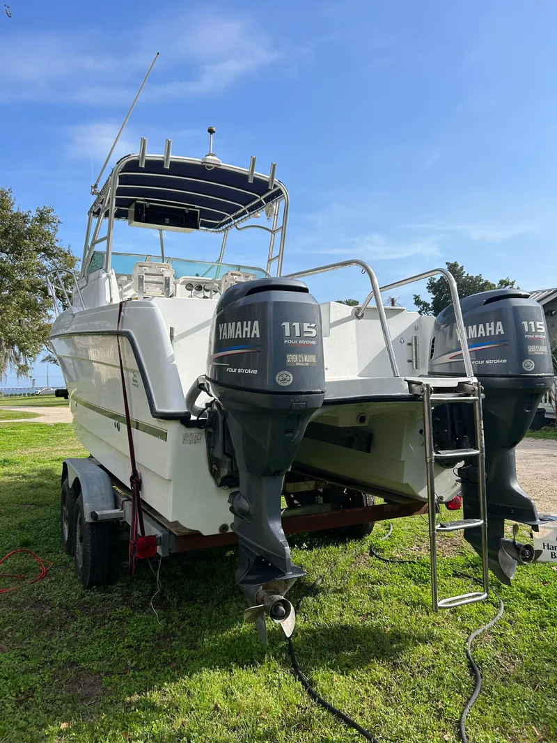 Slide: The Image of 2001 Glacier Bay Island Runner boat with twin Yamaha 115 engines on a trailer. - 2