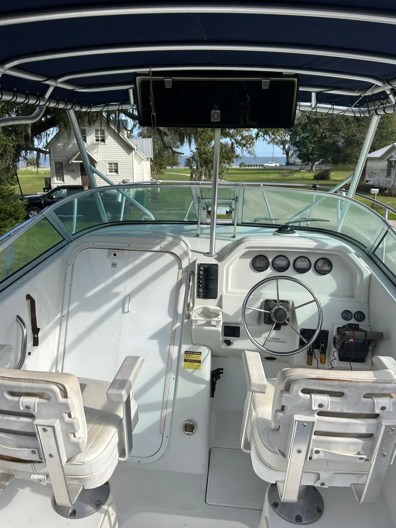 Slide: The Image of 2001 Glacier Bay Island Runner boat cockpit with steering wheel and seating. - 3