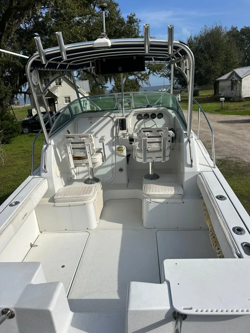 Slide: The Image of 2001 Glacier Bay Island Runner boat interior with seating and steering console. - 4