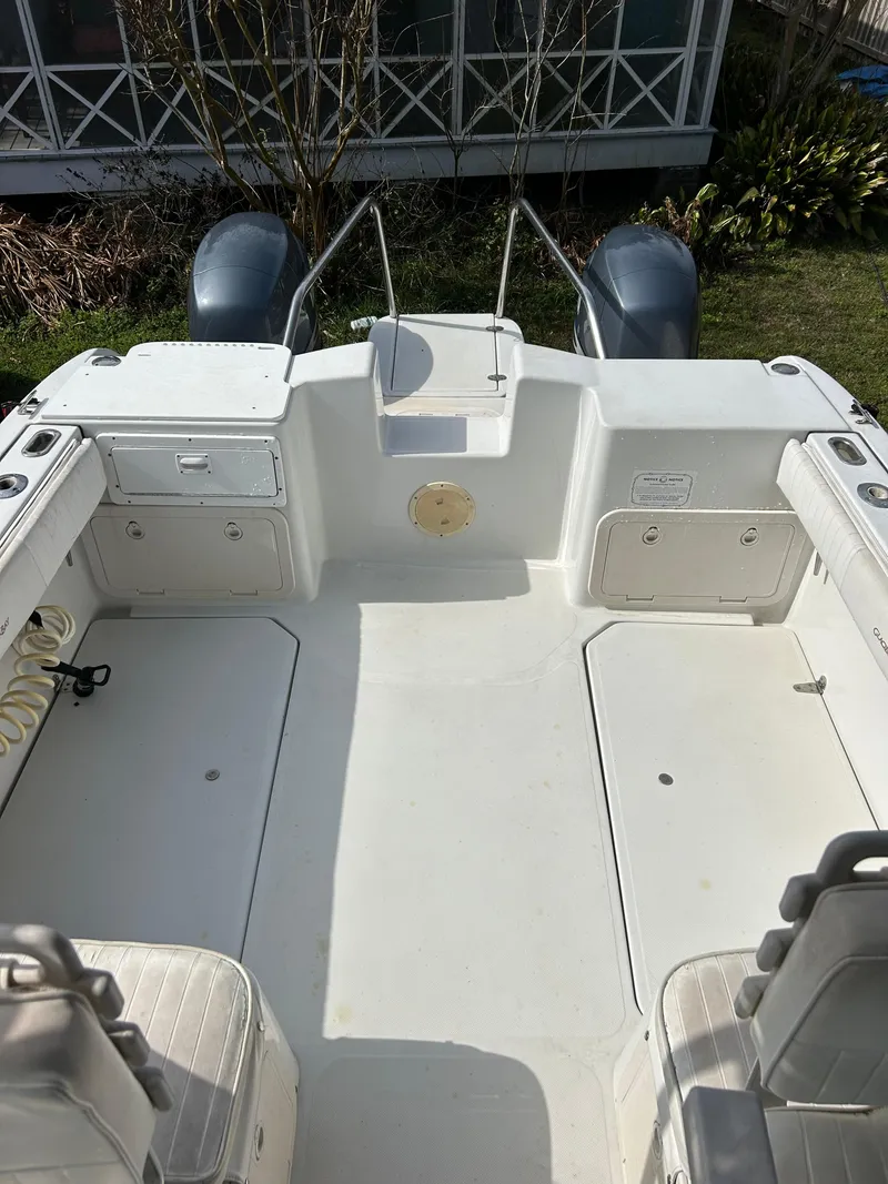 Slide: The Image of 2001 Glacier Bay Island Runner boat interior with dual engines and seating area. - 6