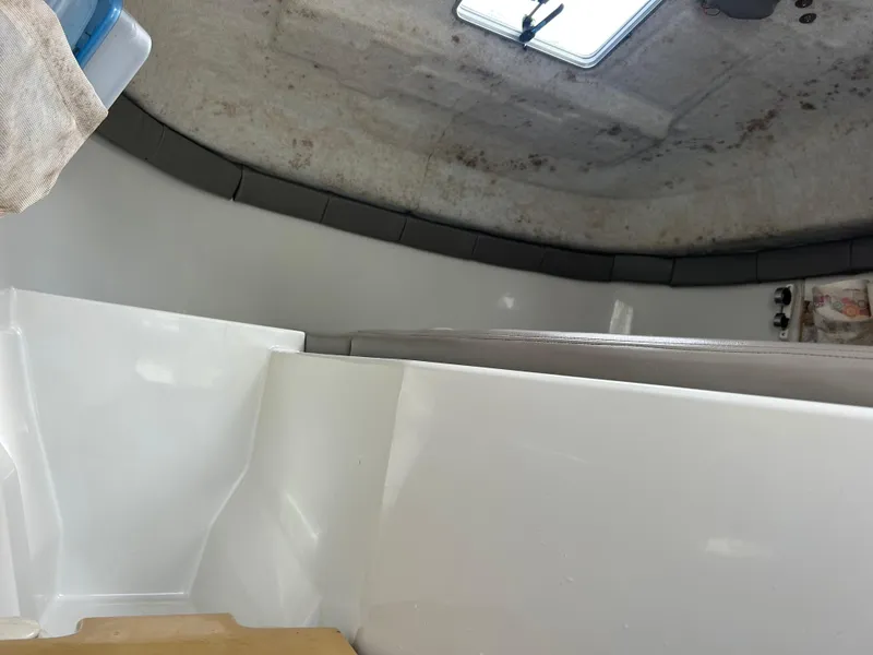 Slide: The Image of Interior of a 2001 Glacier Bay Island Runner boat, showing seating and storage area. - 7