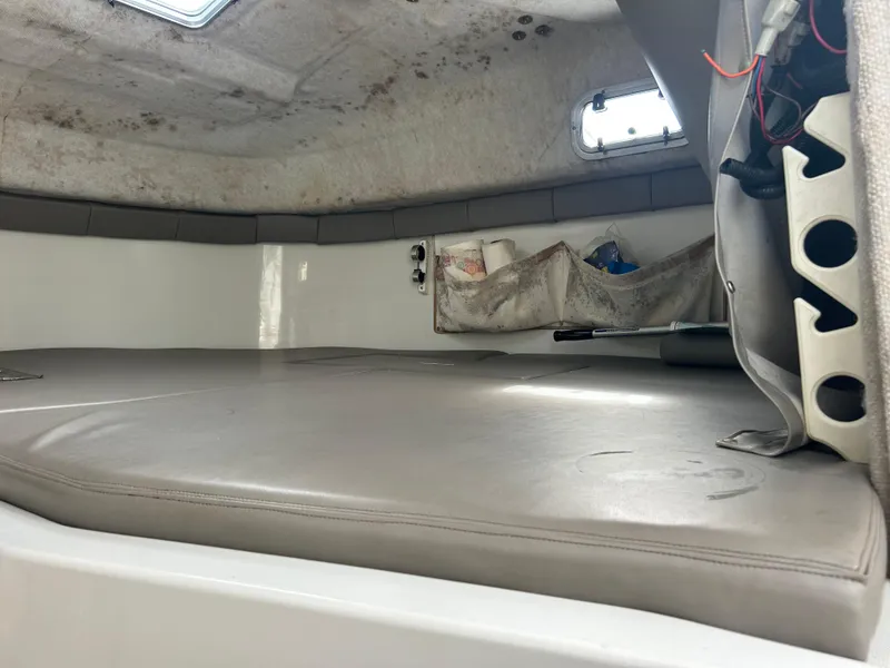 Slide: The Image of Interior cabin of 2001 Glacier Bay Island Runner boat, featuring storage and seating area. - 8