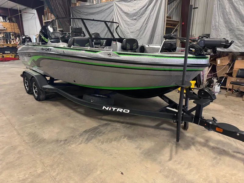 Slide: The Image of 2021 Nitro ZV19 Sport boat on trailer in warehouse setting. - 2