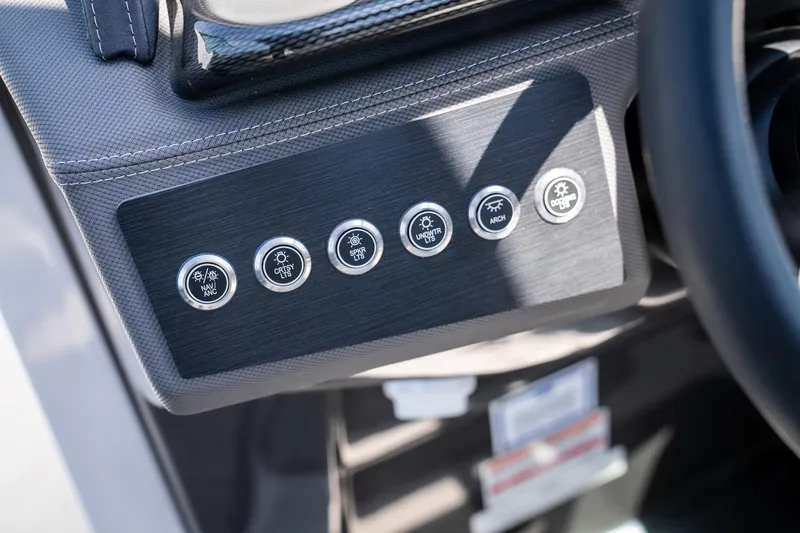 Slide: The Image of Control panel of 2025 Monterey 275 SS Bowrider boat with labeled buttons. - 23