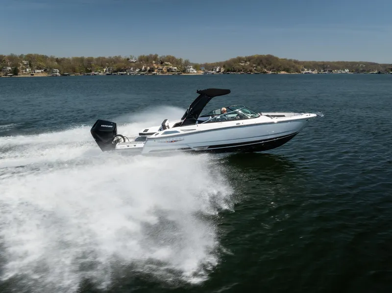 Slide: The Image of 2025 Monterey 275 SS Bowrider speeding on a lake, creating a large wake. - 30