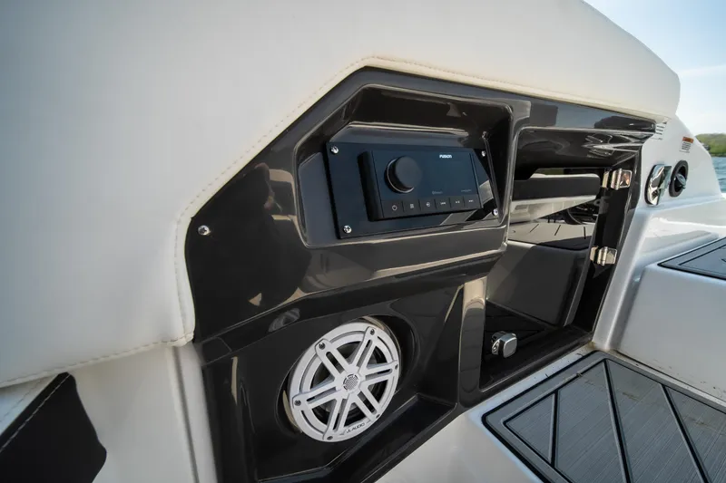Slide: The Image of 2025 Monterey 275 SS Bowrider interior with audio system and speaker detail. - 14