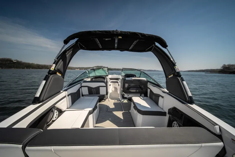Slide: The Image of 2025 Monterey 275 SS Bowrider on water, showcasing spacious seating and sleek design. - 15