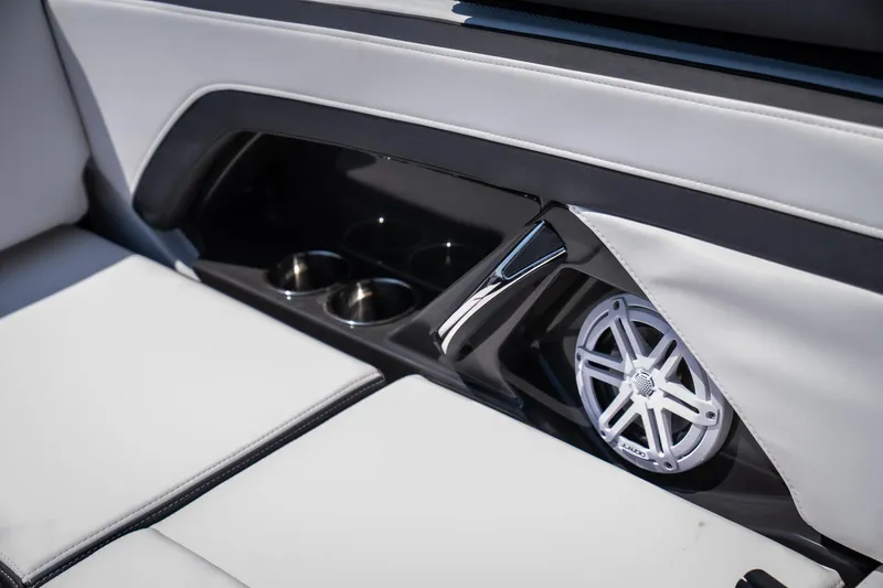 Slide: The Image of 2025 Monterey 275 SS Bowrider interior with cup holders and speaker detail. - 20