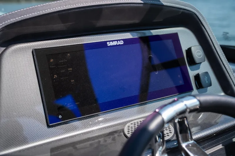 Slide: The Image of Dashboard of 2025 Monterey 275 SS Bowrider with Simrad display and steering wheel. - 24