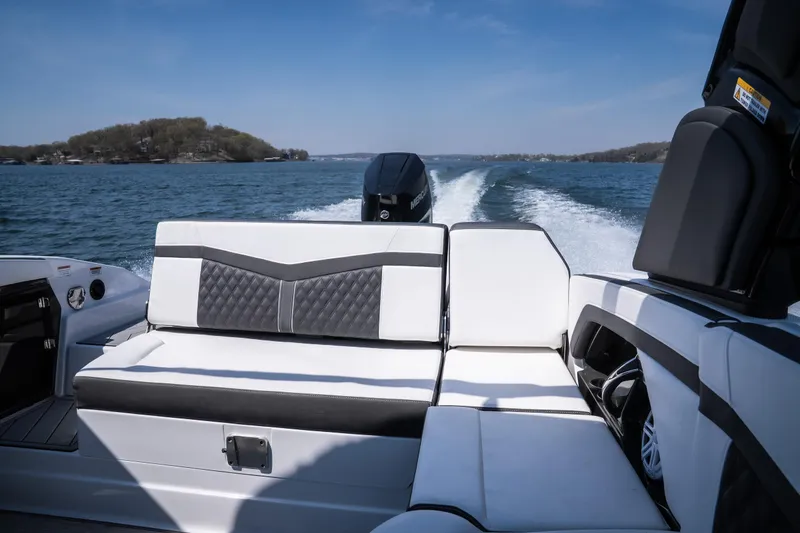 Slide: The Image of 2025 Monterey 275 SS Bowrider cruising on a lake with stylish seating. - 27