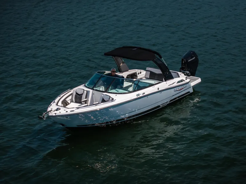 Slide: The Image of 2025 Monterey 275 SS Bowrider cruising on open water, showcasing sleek design and luxury features. - 33