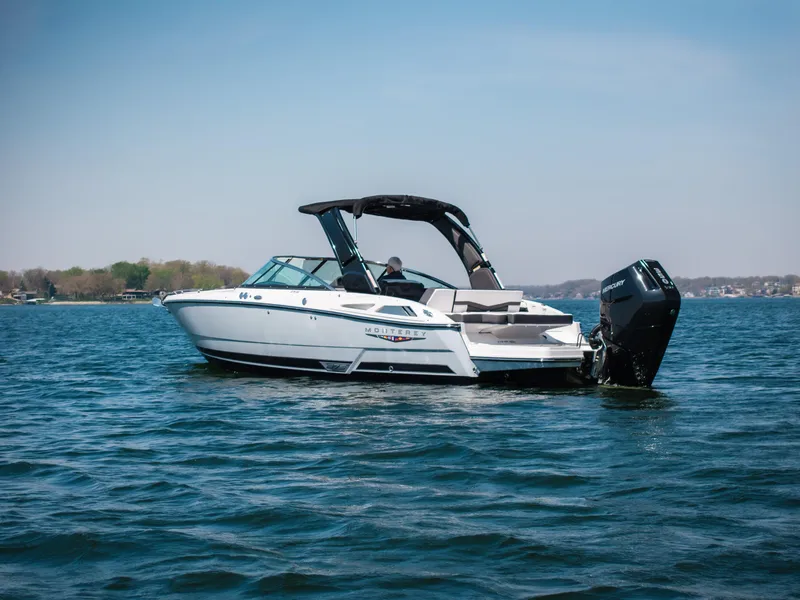 Slide: The Image of 2025 Monterey 275 SS Bowrider on a calm lake under clear skies. - 35