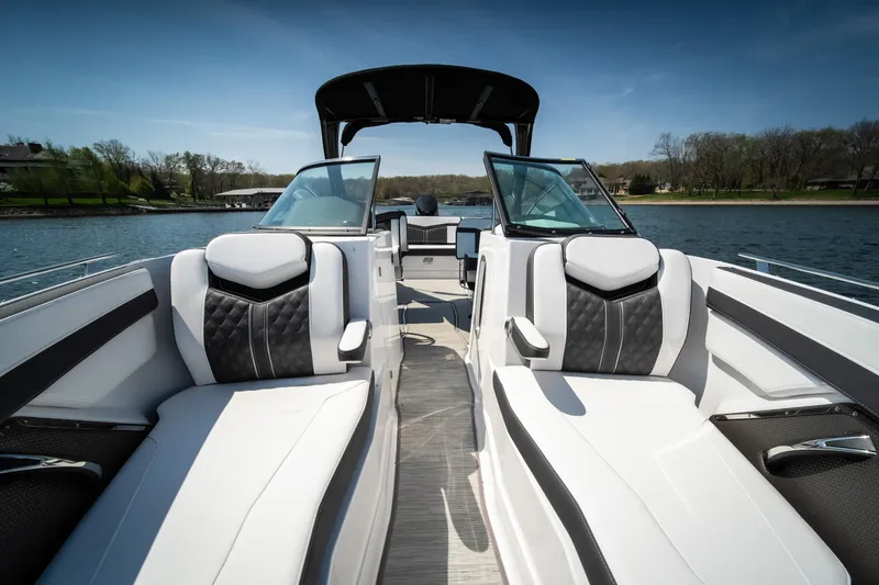 Slide: The Image of 2025 Monterey 275 SS Bowrider with sleek seating on a sunny lake. - 7