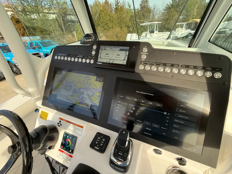 Slide: The Image of 2020 Everglades 273 Center Console dashboard with navigation and control screens. - 14