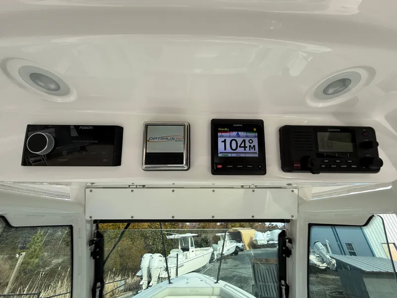 Slide: The Image of Control panel of a 2020 Everglades 273 Center Console boat with navigation instruments. - 16