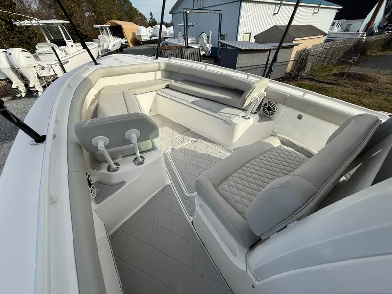 Slide: The Image of 2020 Everglades 273 Center Console boat interior with cushioned seating and modern design. - 20