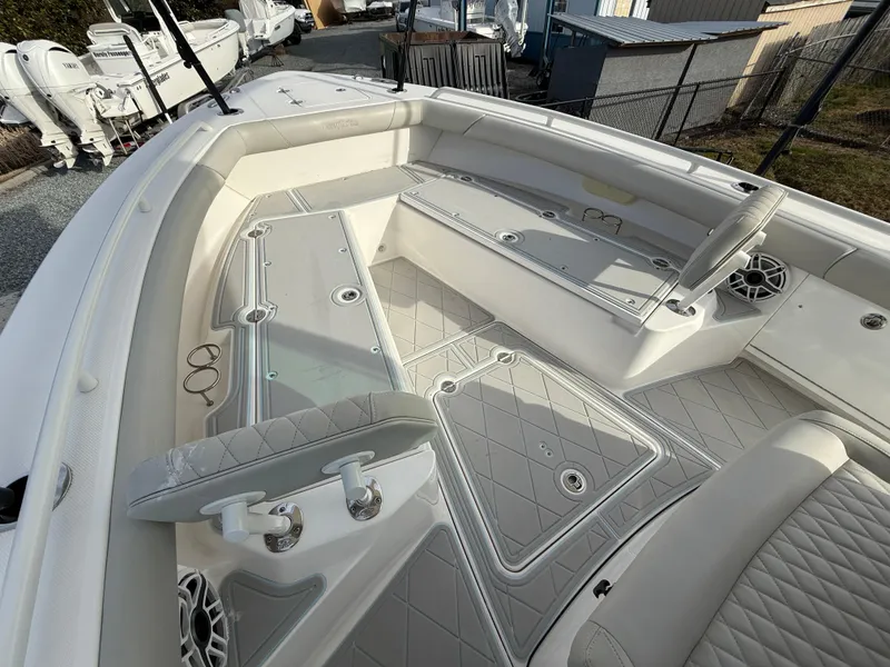 Slide: The Image of 2020 Everglades 273 Center Console boat interior with seating and storage compartments. - 22