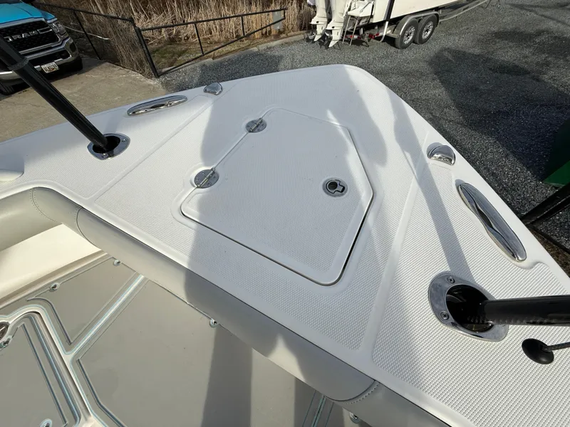 Slide: The Image of 2020 Everglades 273 Center Console boat deck with storage hatch and cleats. - 24