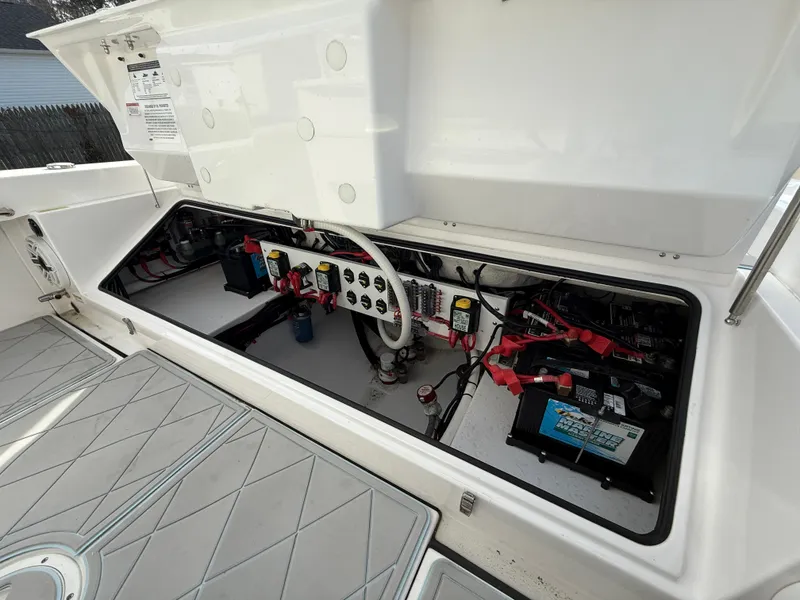 Slide: The Image of Electrical compartment of 2020 Everglades 273 Center Console boat, showing wiring and components. - 8