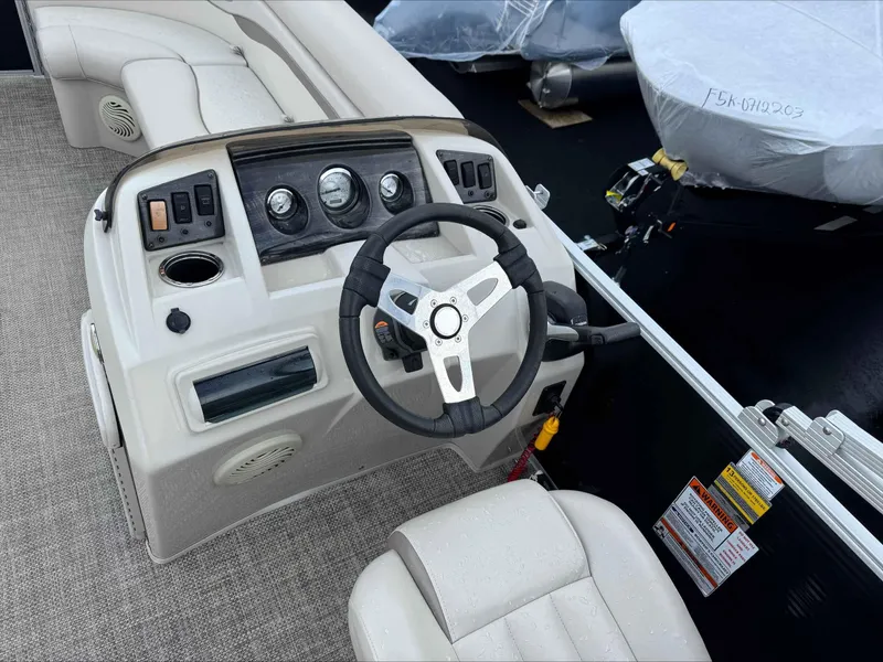 Slide: The Image of 2016 Bennington 22SLXP boat dashboard with steering wheel and controls. - 10