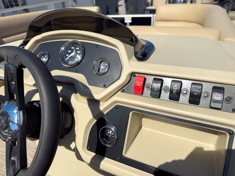 Slide: The Image of Dashboard of 2025 Godfrey Sweetwater Xperience 22' Tritoon boat with steering wheel and controls. - 16