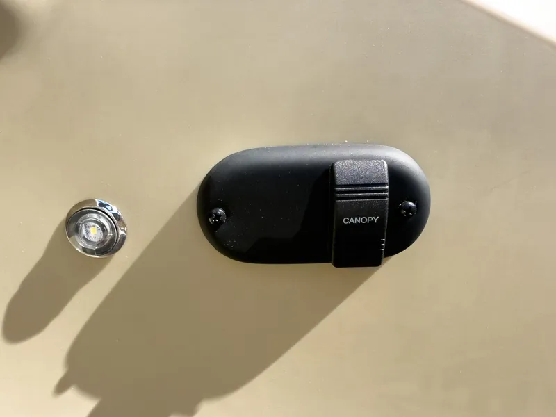 Slide: The Image of Canopy switch on 2025 Godfrey Sweetwater Xperience 22' Tritoon boat. - 17