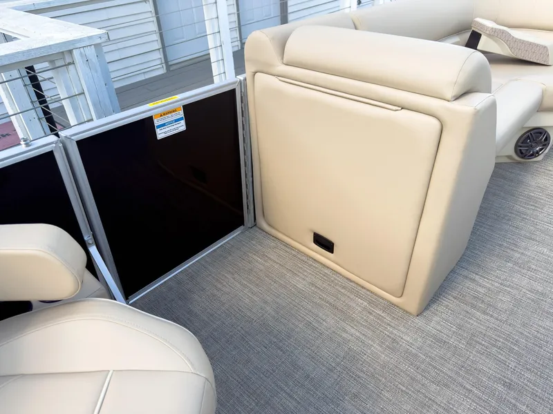 Slide: The Image of 2025 Godfrey Sweetwater Xperience 22' Tritoon interior with beige seating and carpeted flooring. - 21