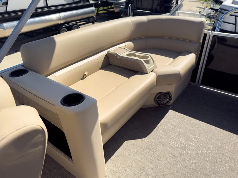 Slide: The Image of 2025 Godfrey Sweetwater Xperience 22' Tritoon with beige split bench seating. - 23