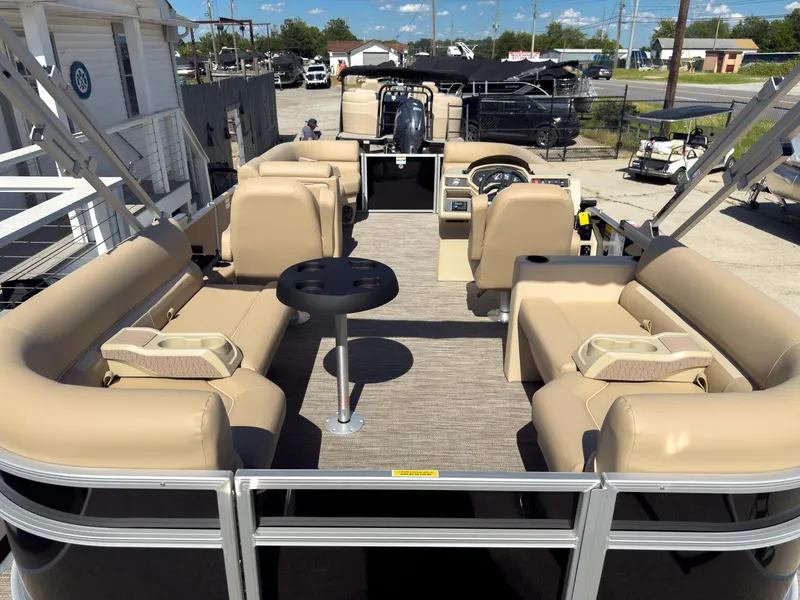 Slide: The Image of 2025 Godfrey Sweetwater Xperience 22' Tritoon with split bench seating and central table. - 25