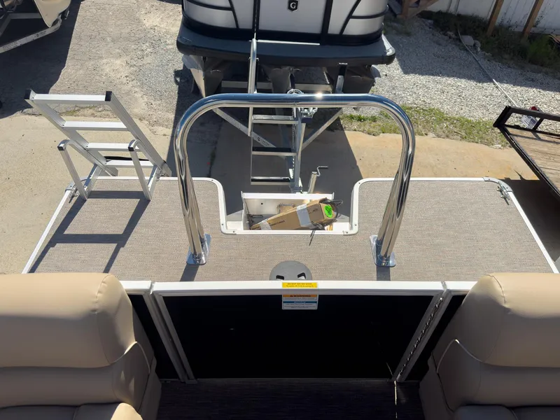 Slide: The Image of 2025 Godfrey Sweetwater Xperience 22' Tritoon rear deck with ladder and seating. - 27