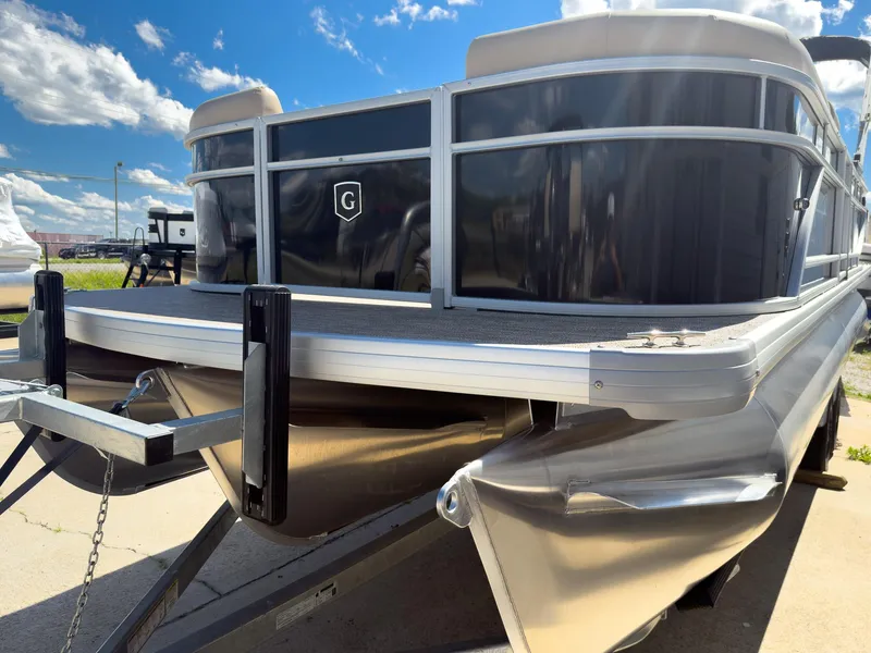 Slide: The Image of 2025 Godfrey Sweetwater Xperience 22' Tritoon boat, front view, on a sunny day. - 4