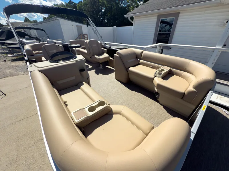 Slide: The Image of 2025 Godfrey Sweetwater Xperience 22' Tritoon with beige seating and split bench layout. - 7