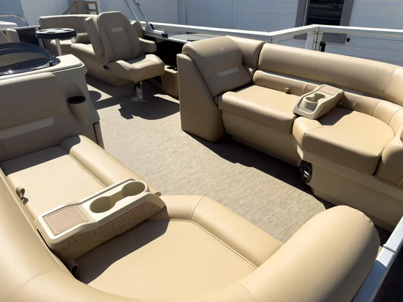 Slide: The Image of 2025 Godfrey Sweetwater Xperience 22' Tritoon interior with beige split bench seating. - 8
