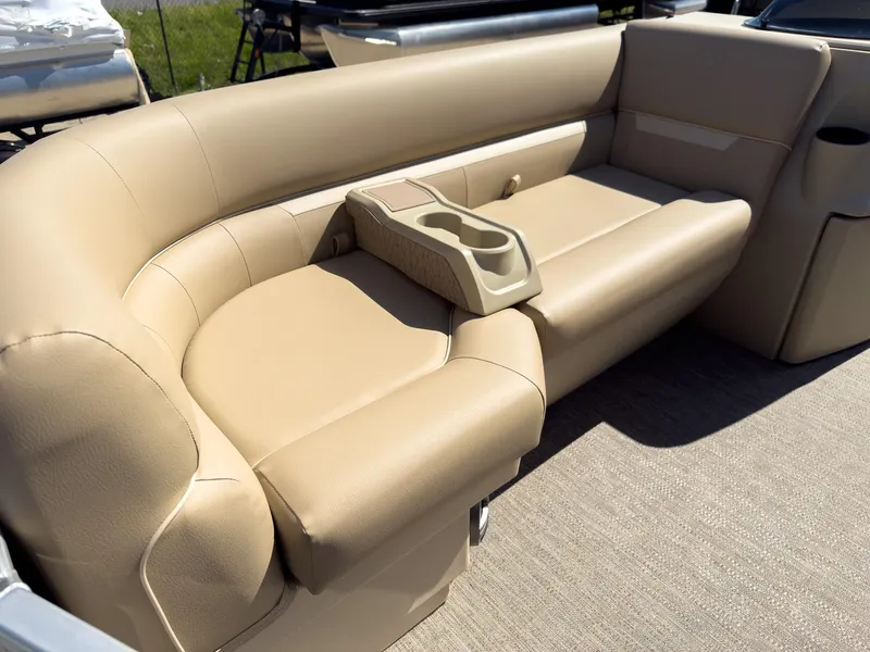 Slide: The Image of 2025 Godfrey Sweetwater Xperience 22' Tritoon beige split bench seating with cup holders. - 9