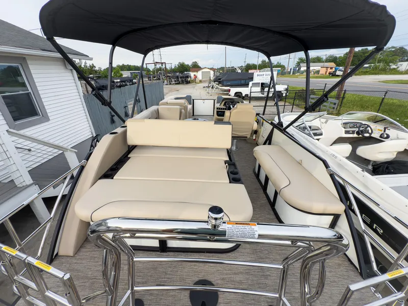 Slide: The Image of 2025 Godfrey Sweetwater 22' Flip Lounge Tritoon with spacious seating and canopy. - 22