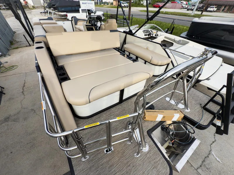 Slide: The Image of 2025 Godfrey Sweetwater 22' Flip Lounge Tritoon with beige seating and stainless steel railings. - 24