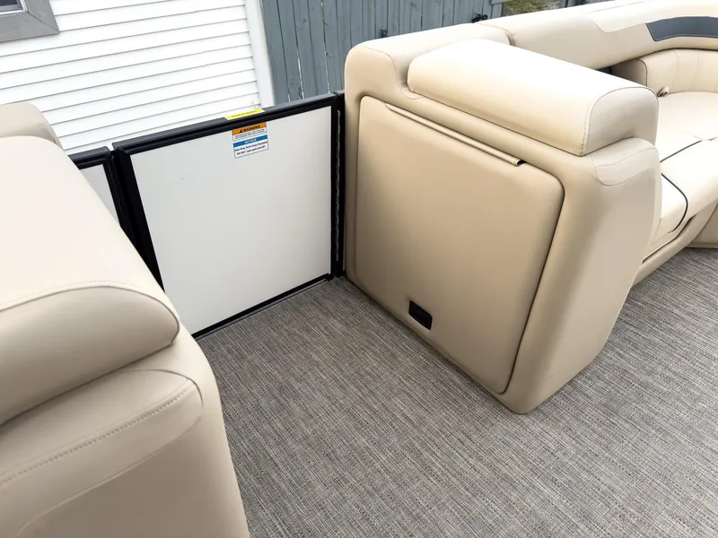 Slide: The Image of 2025 Godfrey Sweetwater 22' Tritoon interior with beige seating and carpeted flooring. - 27