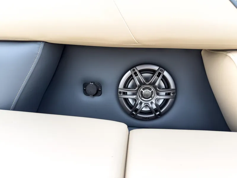 Slide: The Image of Speaker and outlet on Godfrey Sweetwater 22' Flip Lounge Tritoon, 2025 model, beige seating. - 7
