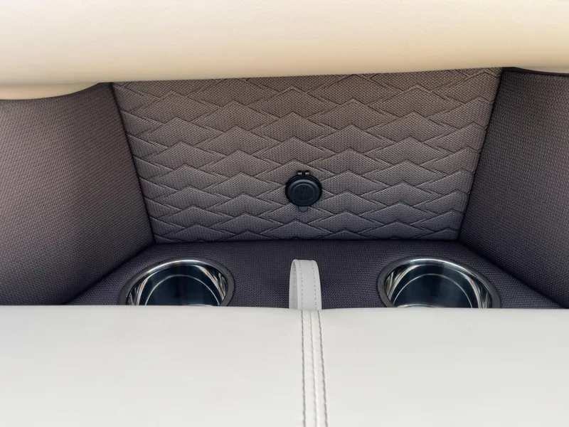 Slide: The Image of 2025 Bentley Pontoons 223 Elite Admiral interior with cup holders and textured upholstery. - 14