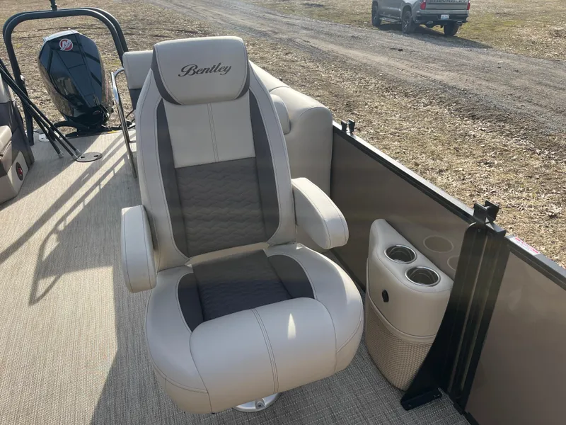 Slide: The Image of 2025 Bentley Pontoons 223 Elite Admiral captain's chair with cup holders on a pontoon boat. - 18