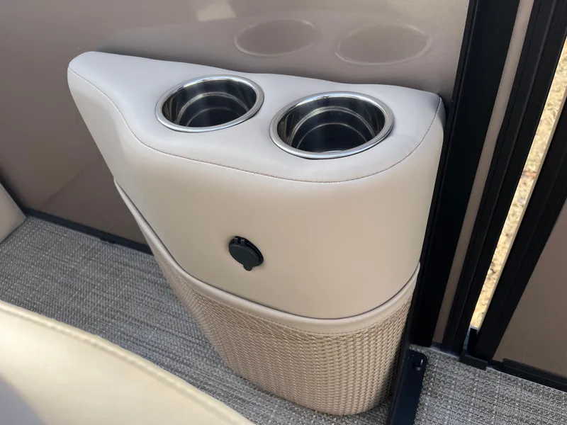 Slide: The Image of Cup holders in 2025 Bentley Pontoons 223 Elite Admiral, featuring sleek beige interior design. - 19