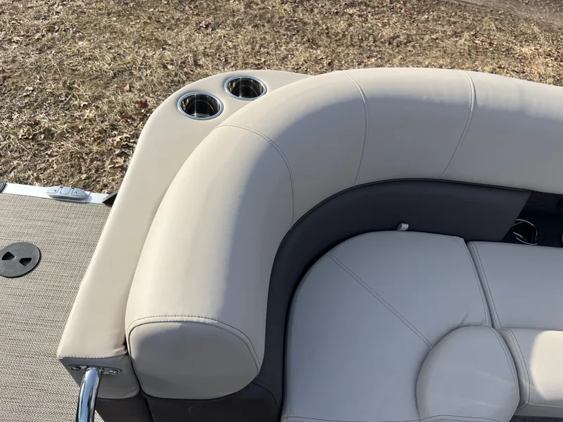 Slide: The Image of 2025 Bentley Pontoons 223 Elite Admiral, luxurious seating with cup holders, beige upholstery. - 27
