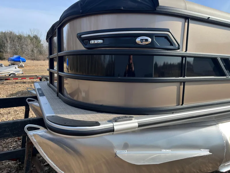 Slide: The Image of 2025 Bentley Pontoons 223 Elite Admiral, sleek design, metallic finish, outdoor setting. - 29