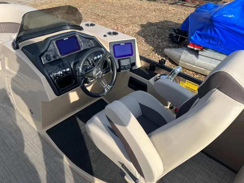 Slide: The Image of 2025 Bentley Pontoons 223 Elite Admiral dashboard with modern controls and comfortable seating. - 8
