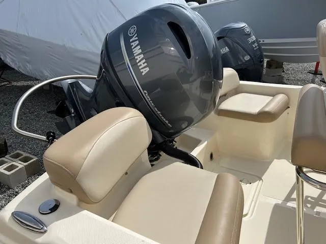 Slide: The Image of 2023 Scout 175 Sportfish boat with Yamaha outboard motor and beige seating. - 10