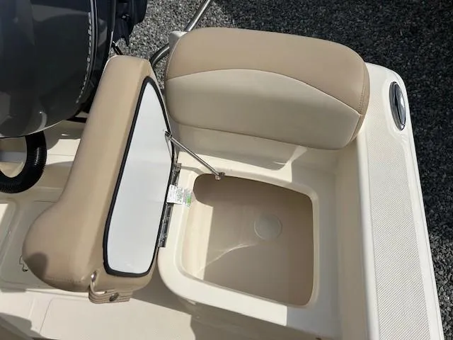 Slide: The Image of 2023 Scout 175 Sportfish boat seat with storage compartment, beige and white upholstery. - 11